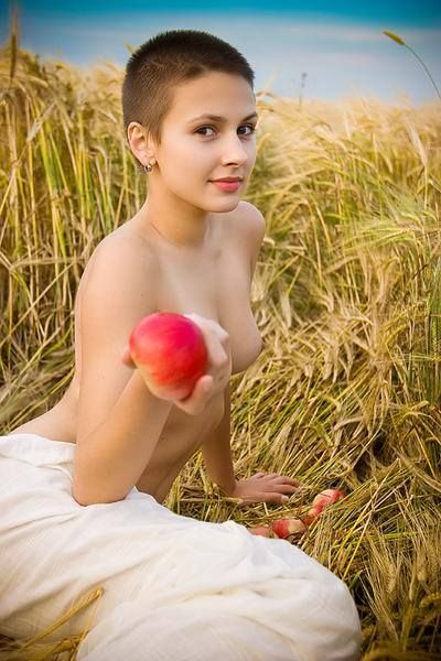 Short haired bombshell in a hay field