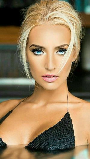 Turquoise-Eyed, Blonde in a Black Knit Bikini Top