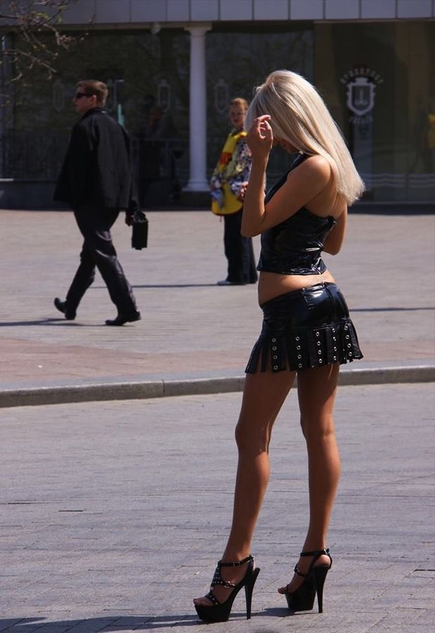 Sexy blonde in leather and high heels