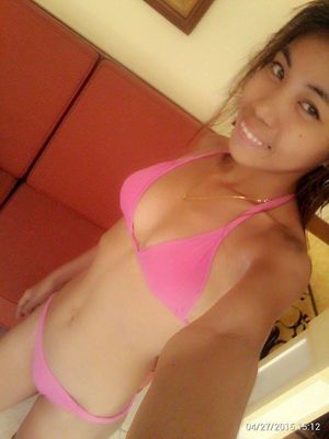 Philippines 18 year old beauty in a skimpy pink bikini with a beautiful Pinay smile