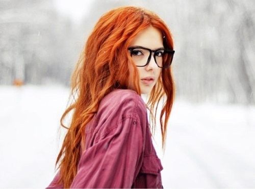 Teen redhead posing outside