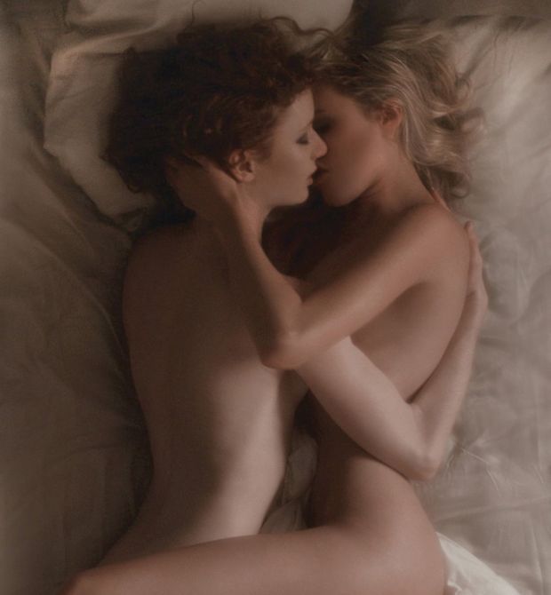 Blonde and redhead kissing