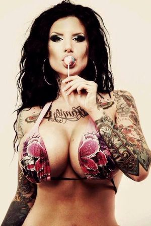 Mya Storm sucks a lolly pop while in a bikini with giant huge model tits - tattooed bimbo - fota ta2 milff