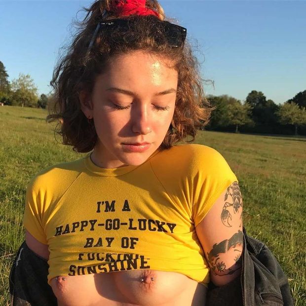 Teen Lily showing off her small tits outdoors
