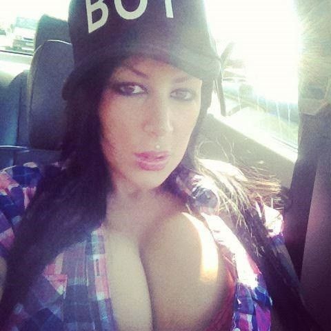Micky Syndrome shows her nice cleavage while in an open button up plaid shirt for Facebook - fota zxzx