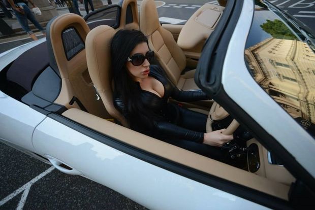 Micky Syndrome is a bad ass bimbo babe in her Ferrari sports car in pvc suit