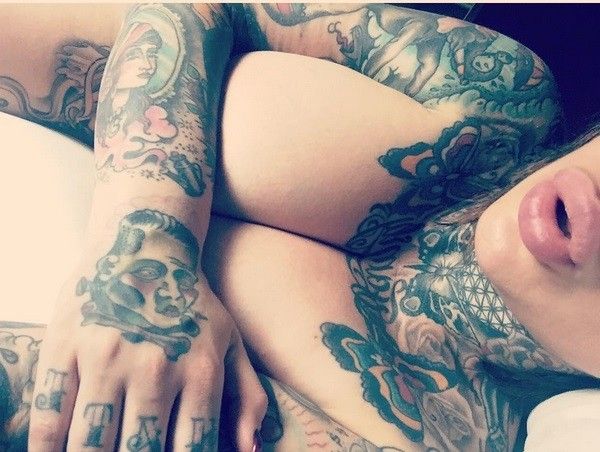 Mya Storm covers her boobs with bimbo plump lips