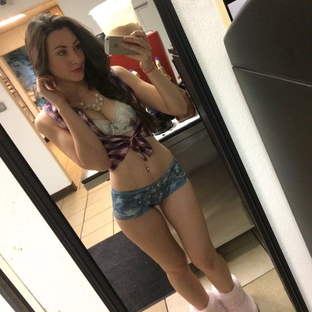Sexy at home in front of a mirror