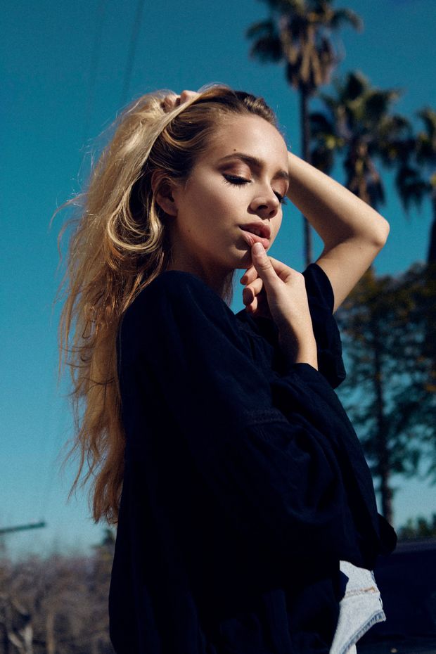 Sexy blonde beauty in blue shirt.