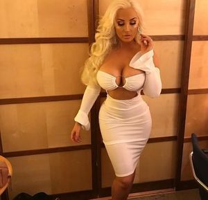 Blonde bimbo in a stunning white dress