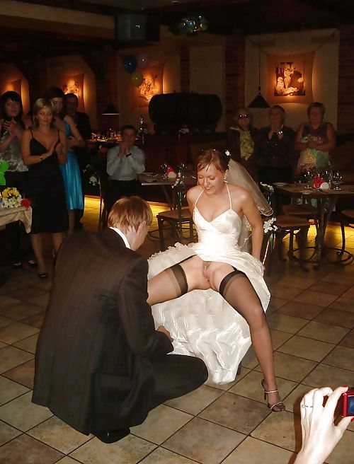 Groom flashing the bride's pussy at the reception.