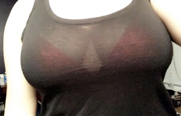 Big tits busting out of red bra through thin top