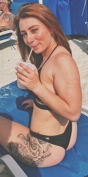 Redhead sitting and showing nice ass