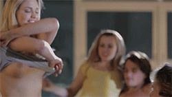 Revealing her new breasts for everyone to see