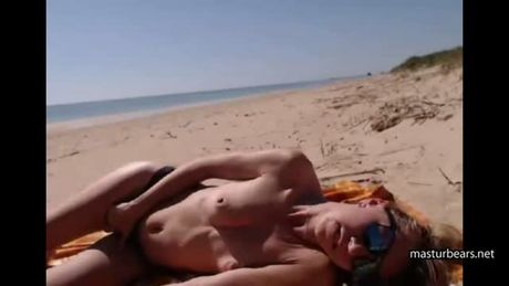 Nina 27 fingering on a public beach