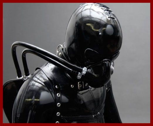 guy in tight rubber overalls with an oxygen mask on his face