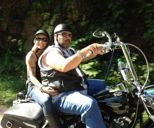 Tiffany Chase is a biker babe with theic fat cool dude in aleather vest riding a motorcycle - SGB
