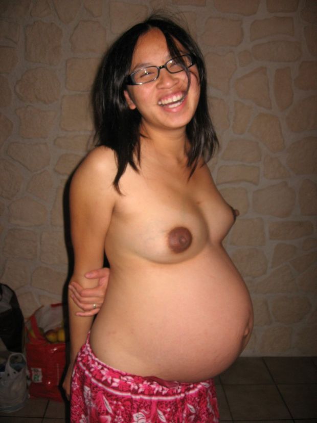 Topless pregnant Asian