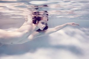 beautiful pale redhead underwater