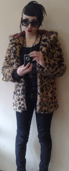 Monique Deville is a bad ass chick in a leopard skin coat al;; super cool w/ sun glasses on - SGB cooll
