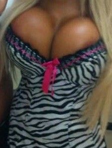 Amy Anderssen aka Barbi Hardcore is a safe haven for sexyness in a sexy zebra skin print suit with cleavage pies on top - SGBb