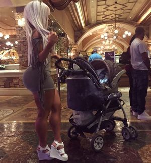 Bambi Barbie pushes her daughter in a carrage basket as she remains curvy & sexy in her grey dress - SGB curvv