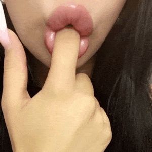big fake lips sucking finger