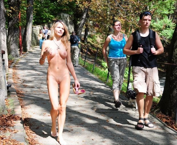 Nude lass walking on public pathway