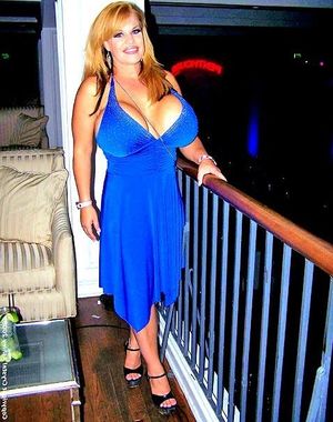 Consolata J Boyle is in electric blue dress with huge milf titties - SGB