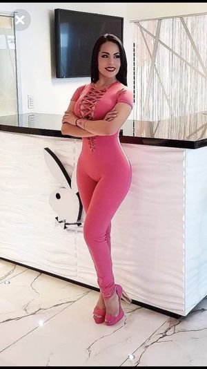 Sexy brunette on thigh pink outfit