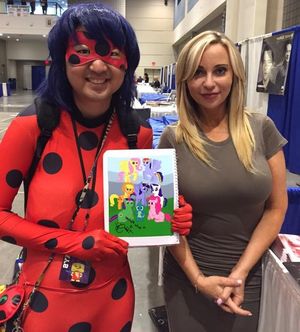 Heinrichina Von Schellendorf with a strange Asian man in lady bug w/ a odd giant huge head - SGB weirdd