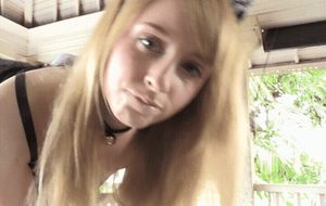 Human kitty licking her milk