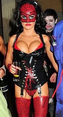 Bimbo in a latex outfit with a mask on - SGB lett