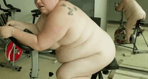 BBW fucking dildo on exercise bike