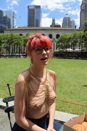 Member of topless coed pulp fiction society in New York sunshine