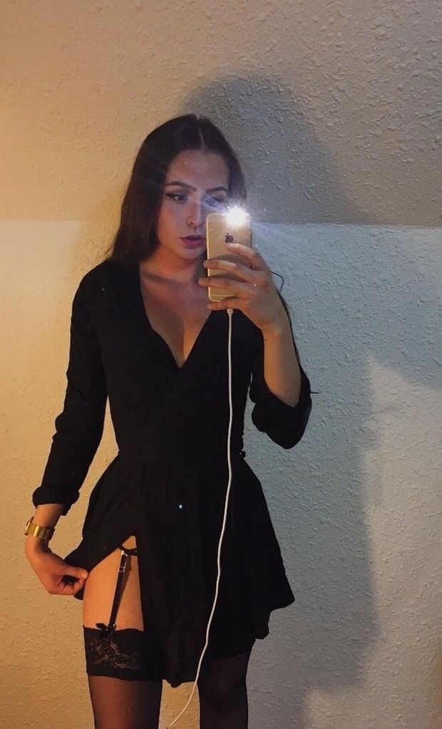 Casually showing her stockings