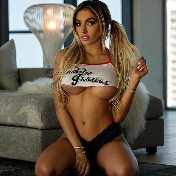 Hot blonde with nice underboob tits wearing a shirt that says Daddy Issues