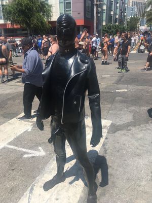 latex gimp with hard cock in public