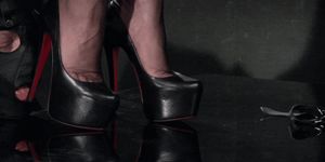 slave licks heel of shoe from mistress