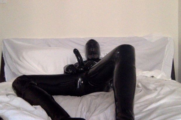Rubber man with hard cock