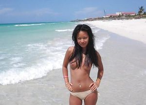 topless Asian on beach