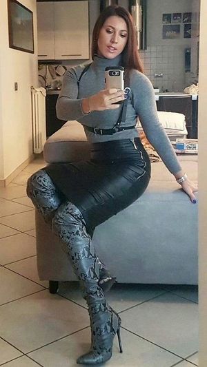 This sexy woman wants to show herself and her boots..