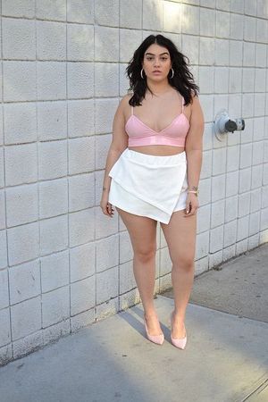 Tiny Pink Top And Short White Skirt With Heels