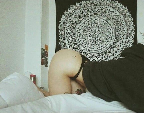 C. Tattooed brunette