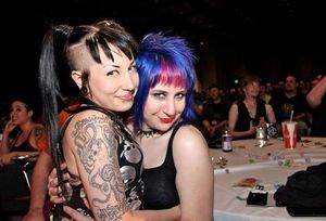 Emo goths Paraquat Suicide & blue haired friend give each other a hug as goth friend is her arm candy - SGB gothh