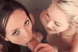 Two babes blonde and brunette give sweet massage to big cock.