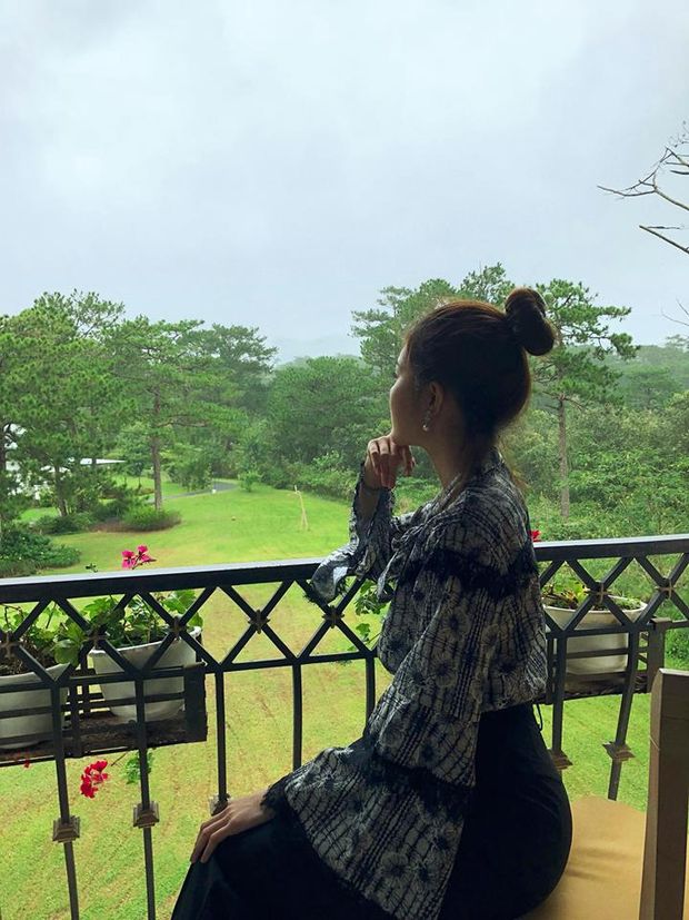 Non-Nude celebrity asian babe Lilly Luta sitting outside over looking her land