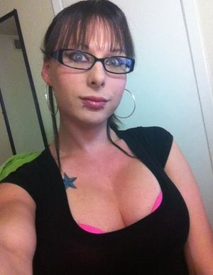 Beautiful college student takes a sexy cleavage shot for Facebook