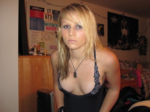 Girlfriend pulling her top down tight