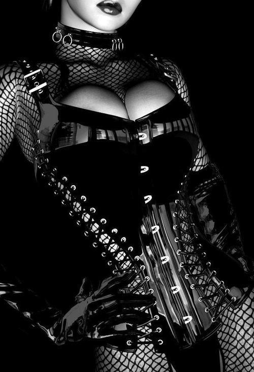 Shiny black corset and fishnets